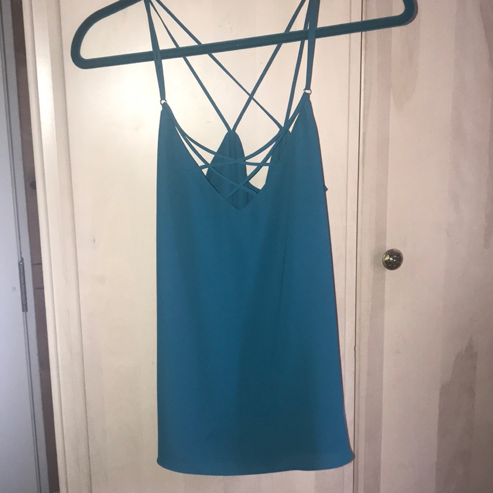 Blue tank top with cross crossing back
